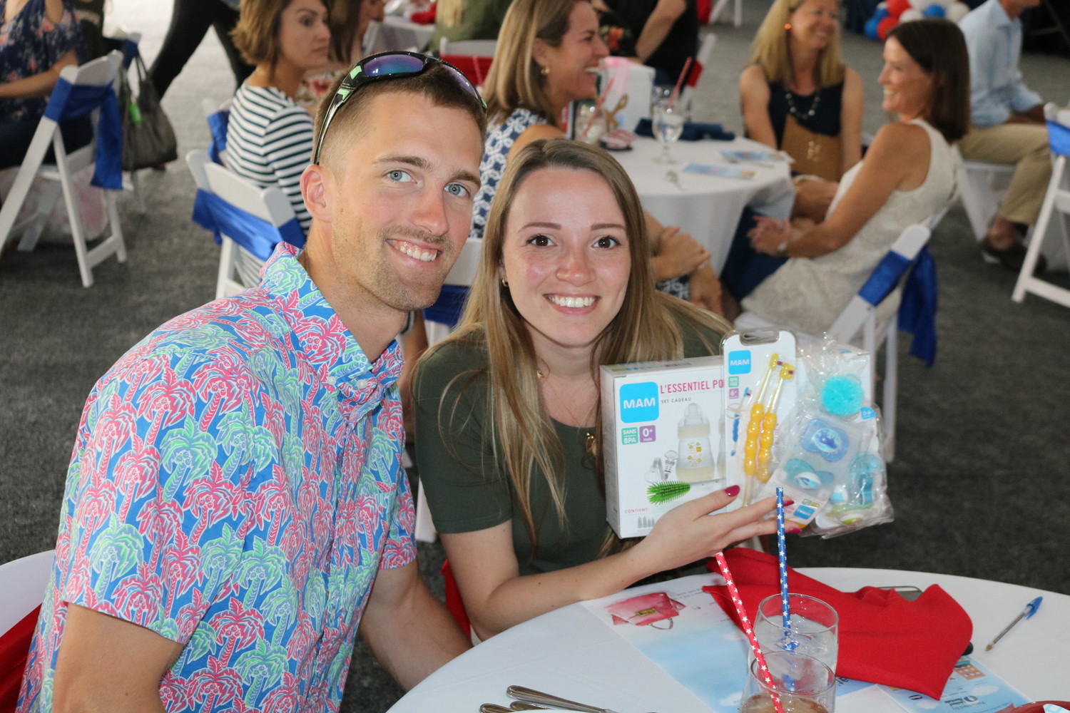 Michael and Meghan Raynes display a gift they received at Operation Shower.
